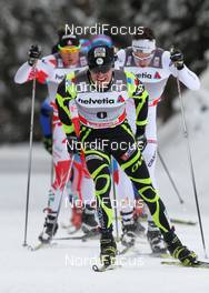 05.01.2012, Cortina-Toblach, Italy (ITA): in front Maurice Manificat (FRA), Fischer, Swix, One Way, behind Marcus Hellner (SWE), Fischer, Salomon, Exel, Craft and Devon Kershaw (CAN), Fischer, Salomon, Swix, One Way  - FIS world cup cross-country, tour de ski, pursuit men, Cortina-Toblach (ITA). www.nordicfocus.com. © Hemmersbach/NordicFocus. Every downloaded picture is fee-liable.