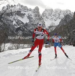 05.01.2012, Cortina-Toblach, Italy (ITA): l-r: Dario Cologna (SUI), Fischer, Rottefella, Alpina, Swix, Odlo and Alexander Legkov (RUS), Rossignol, Rottefella, Swix, adidas  - FIS world cup cross-country, tour de ski, pursuit men, Cortina-Toblach (ITA). www.nordicfocus.com. © Hemmersbach/NordicFocus. Every downloaded picture is fee-liable.