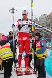 05.01.2012, Cortina-Toblach, Italy (ITA): Petter Northug (NOR), Fischer, Rottefella, Alpina, Ski Go, Swix  getting his transponder - FIS world cup cross-country, tour de ski, pursuit men, Cortina-Toblach (ITA). www.nordicfocus.com. © Hemmersbach/NordicFocus. Every downloaded picture is fee-liable.