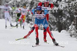 05.01.2012, Cortina-Toblach, Italy (ITA): Alexander Legkov (RUS), Rossignol, Rottefella, Swix, adidas ahead of Petter Northug (NOR), Fischer, Rottefella, Alpina, Ski Go, Swix   - FIS world cup cross-country, tour de ski, pursuit men, Cortina-Toblach (ITA). www.nordicfocus.com. © Hemmersbach/NordicFocus. Every downloaded picture is fee-liable.