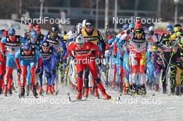 11.02.2012, Nove Mesto, Czech Republic (CZE): start, in front in the center Petter Northug (NOR), Fischer, Rottefella, Alpina, Ski Go, Swix , behind Dario Cologna (SUI), Fischer, Rottefella, Alpina, Swix, Odlo and Devon Kershaw (CAN), Fischer, Salomon, Swix, One Way  - FIS world cup cross-country, mass men, Nove Mesto (CZE). www.nordicfocus.com. © Hemmersbach/NordicFocus. Every downloaded picture is fee-liable.
