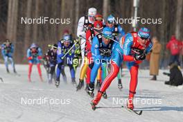 12.02.2012, Nove Mesto, Czech Republic (CZE): in front Dimitri Japarov (RUS), Fischer, Rottefella, Alpina, Swix, Adidas, behind Fabio Pasini (ITA), Fischer, Salomon, One Way  - FIS world cup cross-country, 4x10km men, Nove Mesto (CZE). www.nordicfocus.com. © Hemmersbach/NordicFocus. Every downloaded picture is fee-liable.