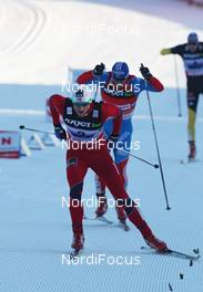 12.02.2012, Nove Mesto, Czech Republic (CZE): Petter Northug (NOR), Fischer, Rottefella, Alpina, Ski Go, Swix  behind Maxim Vylegzhanin (RUS), Fischer, Rottefella, Alpina, Swix, adidas  - FIS world cup cross-country, 4x10km men, Nove Mesto (CZE). www.nordicfocus.com. © Hemmersbach/NordicFocus. Every downloaded picture is fee-liable.