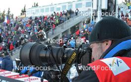 12.02.2012, Nove Mesto, Czech Republic (CZE): photographer in front of the spectators - FIS world cup cross-country, 4x10km men, Nove Mesto (CZE). www.nordicfocus.com. © Hemmersbach/NordicFocus. Every downloaded picture is fee-liable.