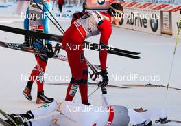 04.03.2012, Lahti, Finland (FIN):  (u-d) Ola Vigen Hattestad (NOR), Fischer, Swix, Rottefella congratulates the winner Emil Joensson (SWE), Fischer, Swix, Salomon, Craft - FIS world cup cross-country, individual sprint, Lahti (FIN). www.nordicfocus.com. Â© Laiho/NordicFocus. Every downloaded picture is fee-liable.