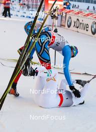 04.03.2012, Lahti, Finland (FIN): (u-d) Nikita Kriukov (RUS), Rossignol, Swix, Rottefella, Adidas congratulates the winner Emil Joensson (SWE), Fischer, Swix, Salomon, Craft  - FIS world cup cross-country, individual sprint, Lahti (FIN). www.nordicfocus.com. Â© Laiho/NordicFocus. Every downloaded picture is fee-liable.