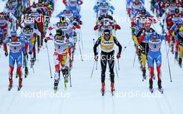 03.03.2012, Lahti, Finland (FIN):  men's mass start, (l-r) Maxim Vylegzhanin (RUS), Fischer, Swix, Alpina, Rottefella, Adidas, Devon Kershaw (CAN), Fischer, Swix, Salomon, One Way, Dario Cologna (SUI), Fischer, Swix, Alpina, Rottefella, Odlo and Alexander Legkov (RUS), Rossignol, Swix, Rottefella, Adidas - FIS world cup cross-country, skiathlon men, Lahti (FIN). www.nordicfocus.com. Â© Laiho/NordicFocus. Every downloaded picture is fee-liable.