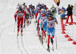 10.03.2012, Oslo, Norway (NOR): in front Alexander Legkov (RUS), Rossignol, Rottefella, Swix, adidas, behind Konstantin Glavatskikh (RUS), Fischer, Rottefella, Alpina, Adidas, Swix  - FIS world cup cross-country, mass men, Oslo (NOR). www.nordicfocus.com. © Hemmersbach/NordicFocus. Every downloaded picture is fee-liable.