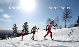 11.03.2012, Oslo, Norway (NOR): Marthe Kristoffersen (NOR), Atomic, Swix, Salomon followed by Nicole Fessel (GER), Rossignol, One Way, Alpina, Rottefella, Adidas and Heidi Weng (NOR), Madshus, Swix, Alpina, Rottefella  - FIS world cup cross-country, 30km mass women, Oslo (NOR). www.nordicfocus.com.Â© Laiho/NordicFocus. Every downloaded picture is fee-liable.