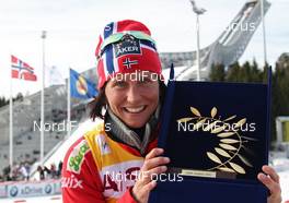 11.03.2012, Oslo, Norway (NOR): Marit Bjoergen (NOR), Fischer, Rottefella, Swix with the AIPS Athlete Trophy 2011 - FIS world cup cross-country, mass women, Oslo (NOR). www.nordicfocus.com. © Hemmersbach/NordicFocus. Every downloaded picture is fee-liable.