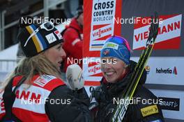 14.03.2012, Stockholm, Sweden (SWE): l-r: Sandra Spitz (GER), media coordinator FIS cross-country and Kikkan Randall (USA), Fischer, Salomon, Swix  - FIS world cup cross-country, individual sprint, Stockholm (SWE). www.nordicfocus.com. © Hemmersbach/NordicFocus. Every downloaded picture is fee-liable.