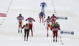 17.03.2012, Falun, Sweden (SWE): final sprint, in front l-r: Dario Cologna (SUI), Fischer, Rottefella, Alpina, Swix, Odlo and Eldar Roenning (NOR), Rossignol, Rottefella, Swix, behind Devon Kershaw (CAN), Fischer, Salomon, Swix, One Way, Niklas Dyrhaug (NOR), Fischer, Rottefella, Alpina, Swix, Len Valjas (CAN), Fischer, Rottefella, Alpina, Swix, One Way  - FIS world cup cross-country, mass men, Falun (SWE). www.nordicfocus.com. © Hemmersbach/NordicFocus. Every downloaded picture is fee-liable.