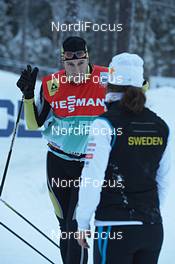 23.11.2012, Gaellivare, Sweden (SWE): Gerhard Urain (AUT), Fischer chief technician, gives some advice - FIS world cup cross-country, training, Gaellivare (SWE). www.nordicfocus.com. © Felgenhauer/NordicFocus. Every downloaded picture is fee-liable.