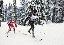 02.12.2012, Kuusamo, Finland (FIN): l-r: Martin Johnsrud Sundby (NOR),  Dario Cologna (SUI) - FIS world cup cross-country, pursuit men, Kuusamo (FIN). www.nordicfocus.com. © Felgenhauer/NordicFocus. Every downloaded picture is fee-liable.