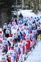 13.12.2012, Canmore, Canada (CAN):  a big group of skiers after the mass start - FIS world cup cross-country, mass men, Canmore (CAN). www.nordicfocus.com. © Roycroft/NordicFocus. Every downloaded picture is fee-liable.