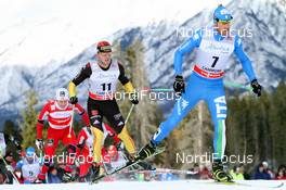 16.12.2012, Canmore, Canada (CAN): David Hofer (ITA) Fischer, Rottefella, Kv+ in front of Jens Filbrich (GER) Rossignol, adidas, One Way, Rottefella - FIS world cup cross-country, skiathlon men, Canmore (CAN). www.nordicfocus.com. © Roycroft/NordicFocus. Every downloaded picture is fee-liable.