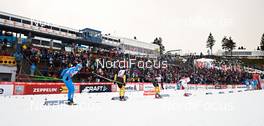 30.12.2012, Oberhof, Germany (GER): a small group passes spectators - FIS world cup cross-country, tour de ski, pursuit men, Oberhof (GER). www.nordicfocus.com. © Felgenhauer/NordicFocus. Every downloaded picture is fee-liable.