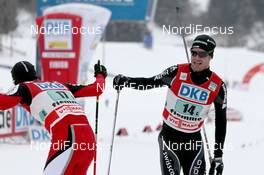 04.02.2012, Val di Fiemme, Italy (ITA): Mario Stecher (AUT), Fischer, Rottefella and Seppi Hurschler (SUI), Fischer, Rottefella, Swix, ODLO - FIS world cup nordic combined, team HS134/2x7.5km, Val di Fiemme (ITA). www.nordicfocus.com. © Manzoni/NordicFocus. Every downloaded picture is fee-liable.