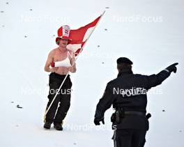 04.01.2012, Innsbruck, Austria (AUT): austrian fan confronted with austrian police - FIS world cup ski jumping, four hills tournament, individual HS130, Innsbruck (AUT). www.nordicfocus.com. © Felgenhauer/NordicFocus. Every downloaded picture is fee-liable.