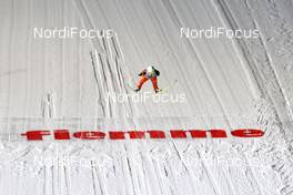 03.02.2012, Val di Fiemme, Italy (ITA): Event Feature: a jumper over the fiemme sign - FIS world cup ski jumping, qualification, Val di Fiemme (ITA). www.nordicfocus.com. © Manzoni/NordicFocus. Every downloaded picture is fee-liable.