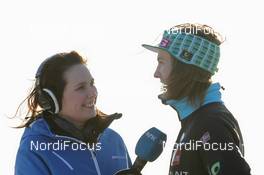 24.02.2012, Vikersund, Norway (NOR): Ida Nysater Rasch (NOR), NRK interviewing Tom Hilde (NOR), Fischer  - FIS world championship ski flying, individual HS225, Vikersund (NOR). www.nordicfocus.com. © Hemmersbach/NordicFocus. Every downloaded picture is fee-liable.