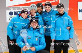 09.03.2012, Oslo, Norway (NOR):  the winner of the team world cup, team USA (l-r) Alissa Johnson, Sarah Hendrickson, the trainer Bernardi Paolo, Jessica Jerome, Abby Hughes and Lindsey Van - FIS world cup ski jumping ladies, individual HS106, Oslo (NOR). www.nordicfocus.com. Â© Laiho/NordicFocus. Every downloaded picture is fee-liable.