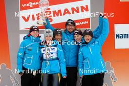 09.03.2012, Oslo, Norway (NOR):  the winner of the team world cup, team USA (l-r) Alissa Johnson, Sarah Hendrickson, Jessica Jerome, the trainer Bernardi Paolo, Abby Hughes and Lindsey Van - FIS world cup ski jumping ladies, individual HS106, Oslo (NOR). www.nordicfocus.com. Â© Laiho/NordicFocus. Every downloaded picture is fee-liable.