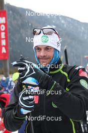 29.01.2012, Val di Fassa / Val di Fiemme , Italy (ITA): Jorgen Aukland (NOR), Team Xtra, Atomic, Swix, Salomon prepares his poles at the start - FIS Marathon Cup Marcialonga, Val di Fassa / Val di Fiemme (ITA). www.nordicfocus.com. © Hemmersbach/NordicFocus. Every downloaded picture is fee-liable.