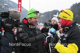 29.01.2012, Val di Fassa / Val di Fiemme , Italy (ITA): Petter Northug (NOR), Fischer, Rottefella, Alpina, Ski Go, Swix, United Bakeries    gives an interview to Ski Classics at the start - FIS Marathon Cup Marcialonga, Val di Fassa / Val di Fiemme (ITA). www.nordicfocus.com. © Hemmersbach/NordicFocus. Every downloaded picture is fee-liable.