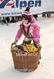 11.-12.02.2012, St. Johann, Austria (AUT): to much Storck sweets to carry for the young athlet - Int. Tiroler Koasalauf, St. Johann (AUT). www.nordicfocus.com. © Felgenhauer/NordicFocus. Every downloaded picture is fee-liable.
