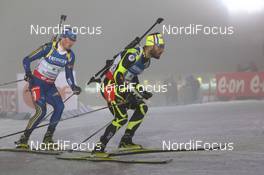 04.01.2013, Oberhof, Germany (GER): Simon Fourcade (FRA), Fischer, Rottefella, Rossignol, Swix, Fredrik Lindstroem (SWE), Fischer, Rottefella, Swix, adidas - IBU world cup biathlon, relay men, Oberhof (GER). www.nordicfocus.com. © Manzoni/NordicFocus. Every downloaded picture is fee-liable.