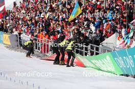 02.03.2013, Oslo, Norway (NOR): Event Feature: strong wind crashed advertisment boards - IBU world cup biathlon Holmenkollen, pursuit women, Oslo (NOR). www.nordicfocus.com. © Manzoni/NordicFocus. Every downloaded picture is fee-liable.