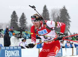 09.03.2013, Sochi, Russia (RUS): Dominik Landertinger (AUT), Atomic, Alpina, Leki - IBU world cup biathlon, sprint men, Sochi (RUS). www.nordicfocus.com. © Manzoni/NordicFocus. Every downloaded picture is fee-liable.