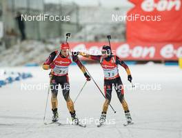 24.11.2013, Oestersund, Sweden (SWE): Arnd Peiffer (GER), Andrea Henkel (GER) - IBU world cup biathlon, relay mixed, Oestersund (SWE). www.nordicfocus.com. © Manzoni/NordicFocus. Every downloaded picture is fee-liable.