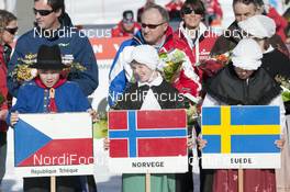 20.01.2013, La Clusaz, France (FRA): Kidz with flags of the podium - FIS world cup cross-country, 4x7.5km men, La Clusaz (FRA). www.nordicfocus.com. © Becker/NordicFocus. Every downloaded picture is fee-liable.