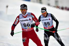 17.02.2013, Davos, Switzerland (SUI): l-r:  Martin Johnsrud Sundby (NOR), Erwan Kaeser (SUI) - FIS world cup cross-country, 15km men, Davos (SUI). www.nordicfocus.com. © Felgenhauer/NordicFocus. Every downloaded picture is fee-liable.
