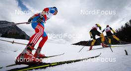27.02.2013, Val di Fiemme, Italy (ITA):  (l-r) Maxim Vylegzhanin (RUS), Fischer, Swix, Alpina, Rottefella, Adidas, Hannes Dotzler (GER), Fischer, Swix, Alpina, Rottefella, Adidas and Axel Teichmann (GER), Madshus, Swix, Rottefella, Adidas - FIS nordic world ski championships, cross-country, 15km men, Val di Fiemme (ITA). www.nordicfocus.com. © Laiho/NordicFocus. Every downloaded picture is fee-liable.