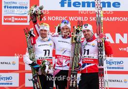 27.02.2013, Val di Fiemme, Italy (ITA):  (l-r) Johan Olsson (SWE), Fischer, Swix, Alpina, Rottefella, Craft, Petter Northug (NOR), Fischer, Swix, Alpina, Rottefella and Tord Asle Gjerdalen (NOR), Atomic, One Way, Salomon, Swix, Skigo - FIS nordic world ski championships, cross-country, 15km men, Val di Fiemme (ITA). www.nordicfocus.com. © Laiho/NordicFocus. Every downloaded picture is fee-liable.