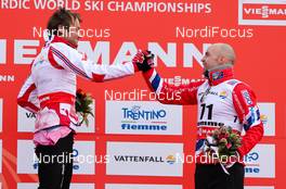 27.02.2013, Val di Fiemme, Italy (ITA): (l-r) Petter Northug (NOR), Fischer, Swix, Alpina, Rottefella and Tord Asle Gjerdalen (NOR), Atomic, One Way, Salomon, Swix, Skigo  - FIS nordic world ski championships, cross-country, 15km men, Val di Fiemme (ITA). www.nordicfocus.com. © Laiho/NordicFocus. Every downloaded picture is fee-liable.