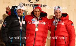 27.02.2013, Val di Fiemme, Italy (ITA): (l-r) Johan Olsson (SWE), Fischer, Swix, Alpina, Rottefella, Craft, Petter Northug (NOR), Fischer, Swix, Alpina, Rottefella and Tord Asle Gjerdalen (NOR), Atomic, One Way, Salomon, Swix, Skigo  - FIS nordic world ski championships, cross-country, 15km men, Val di Fiemme (ITA). www.nordicfocus.com. © Laiho/NordicFocus. Every downloaded picture is fee-liable.