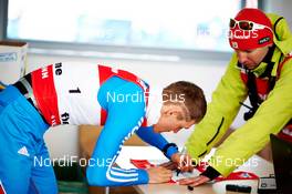 21.02.2013, Val di Fiemme, Italy (ITA):  Nikita Kriukov (RUS) signing the world championship bib - FIS nordic world ski championships, cross-country, individual sprint, Val di Fiemme (ITA). www.nordicfocus.com. © Felgenhauer/NordicFocus. Every downloaded picture is fee-liable.