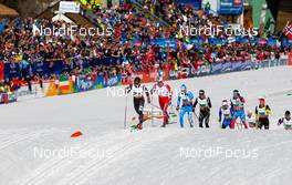 01.03.2013, Val di Fiemme, Italy (ITA): Kris Freeman (USA), Fischer, Swix, Alpina, Rottefella followed by Eldar Roenning (NOR), Rorrignol, Swix, Rottefella, Giorgio di Centa (ITA), Fischer, Swix, Alpina, Rottefella, Rudy Project and Dario Cologna (SUI), Fischer, Swix, Alpina, Rottefella, Odlo - FIS nordic world ski championships, cross-country, 4x10km men, Val di Fiemme (ITA). www.nordicfocus.com. © Laiho/NordicFocus. Every downloaded picture is fee-liable.