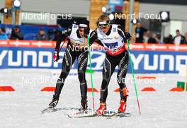 01.03.2013, Val di Fiemme, Italy (ITA): (l-r) Toni Livers (SUI), Rossignol, Swix, Rottefella, Odlo and Remo Fischer (SUI), Fischer, KV+, Alpina, Rottefella, Odlo - FIS nordic world ski championships, cross-country, 4x10km men, Val di Fiemme (ITA). www.nordicfocus.com. © Laiho/NordicFocus. Every downloaded picture is fee-liable.