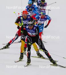 23.02.2013, Val di Fiemme, Italy (ITA):  Dario Cologna (SUI), Fischer, Swix, Alpina, Rottefella, Odlo followed by Tobias Angerer (GER), Fischer, One Way, Rottefella, Adidas - FIS nordic world ski championships, cross-country, skiathlon men, Val di Fiemme (ITA). www.nordicfocus.com. © Laiho/NordicFocus. Every downloaded picture is fee-liable.