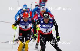 23.02.2013, Val di Fiemme, Italy (ITA): (l-r) Tobias Angerer (GER), Fischer, One Way, Rottefella, Adidas and Dario Cologna (SUI), Fischer, Swix, Alpina, Rottefella, Odlo  - FIS nordic world ski championships, cross-country, skiathlon men, Val di Fiemme (ITA). www.nordicfocus.com. © Laiho/NordicFocus. Every downloaded picture is fee-liable.