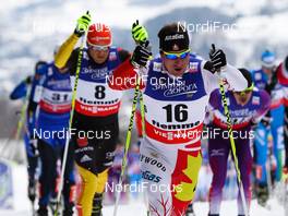 23.02.2013, Val di Fiemme, Italy (ITA):  Ivan Babikov (CAN), Salomon, One Way followed by Tobias Angerer (GER), Fischer, One Way, Rottefella, Adidas - FIS nordic world ski championships, cross-country, skiathlon men, Val di Fiemme (ITA). www.nordicfocus.com. © Laiho/NordicFocus. Every downloaded picture is fee-liable.