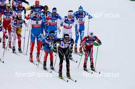 23.02.2013, Val di Fiemme, Italy (ITA):  in the leading (l-r) Dario Cologna (SUI), Fischer, Swix, Alpina, Rottefella, Odlo and Sjur Roethe (NOR), Fischer, KV+, Salomon, Swix  - FIS nordic world ski championships, cross-country, skiathlon men, Val di Fiemme (ITA). www.nordicfocus.com. © Laiho/NordicFocus. Every downloaded picture is fee-liable.