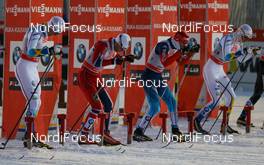 29.11.2013, Kuusamo, Finland (FIN): (l-r) Calle Halfvarsson (SWE), Fischer, Skigo, Salomon, Craft, Eirik Brandsdal (NOR), Fischer, Swix, Alpina, Rottefella, Anton Gafarov (RUS), Salomon, Swix, Adidas and Teodor Peterson (SWE), Rossignol, Skigo, Rottefella, Craft - FIS world cup cross-country, individual sprint, Kuusamo (FIN). www.nordicfocus.com. © Laiho/NordicFocus. Every downloaded picture is fee-liable.