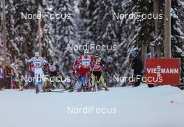 01.12.2013, Kuusamo, Finland (FIN): (l-r) Marcus Hellner (SWE), Fischer, Swix, Alpina, Rottefella, Craft and Martin Johnsrud Sundby (NOR), Fischer, KV+, Rottefella, Swix - FIS world cup cross-country, pursuit men, Kuusamo (FIN). www.nordicfocus.com. © Laiho/NordicFocus. Every downloaded picture is fee-liable.