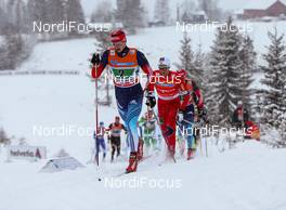 08.12.2013, Lillehammer, Norway (NOR): Alexander Bessmertnykh (RUS), Madshus, Swix, Alpina, Rottefella, Adidas followed by Didrik Toenseth (NOR), Madshus, Swix, Alpina, Rottefella, Skigo - FIS world cup cross-country, 4x7.5km men, Lillehammer (NOR). www.nordicfocus.com. © Laiho/NordicFocus. Every downloaded picture is fee-liable.